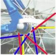 The lacing pattern of the rear wheel can be clearly seen. Pull spokes are in blue, and push spokes are in red. - click for full size image